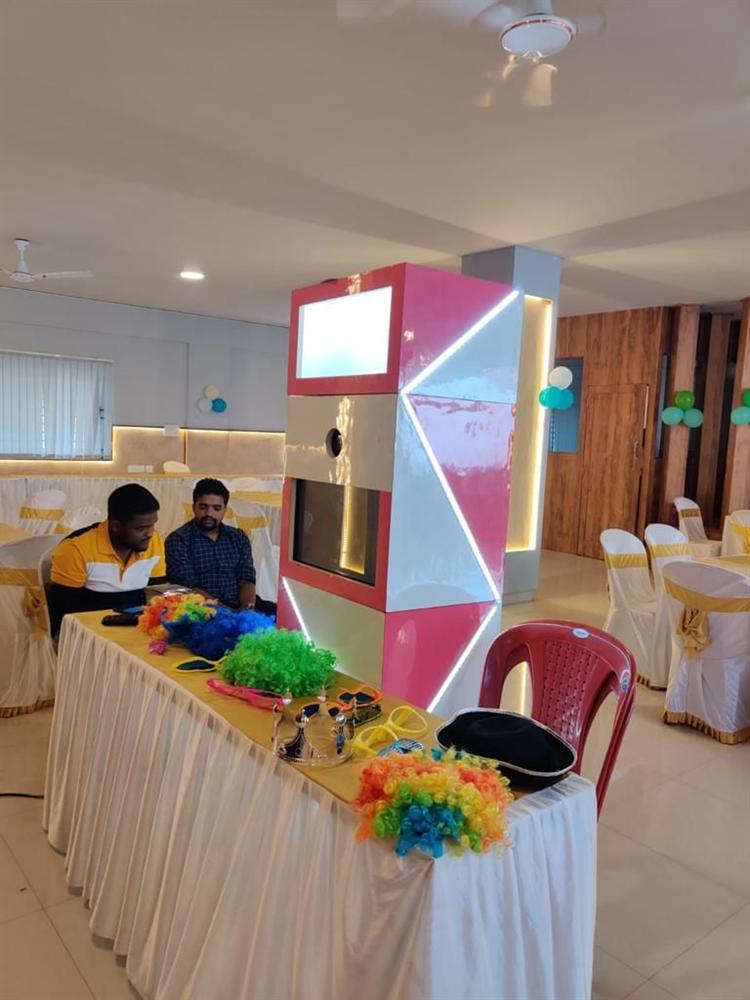 Pixelscue crew setting up a photo booth on-site
