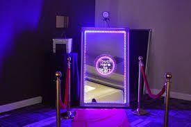 Interactive mirror booth with touch-screen prompts